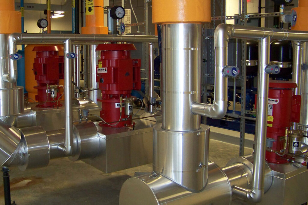 Image of stainless steel pipes in a manufacturing environment